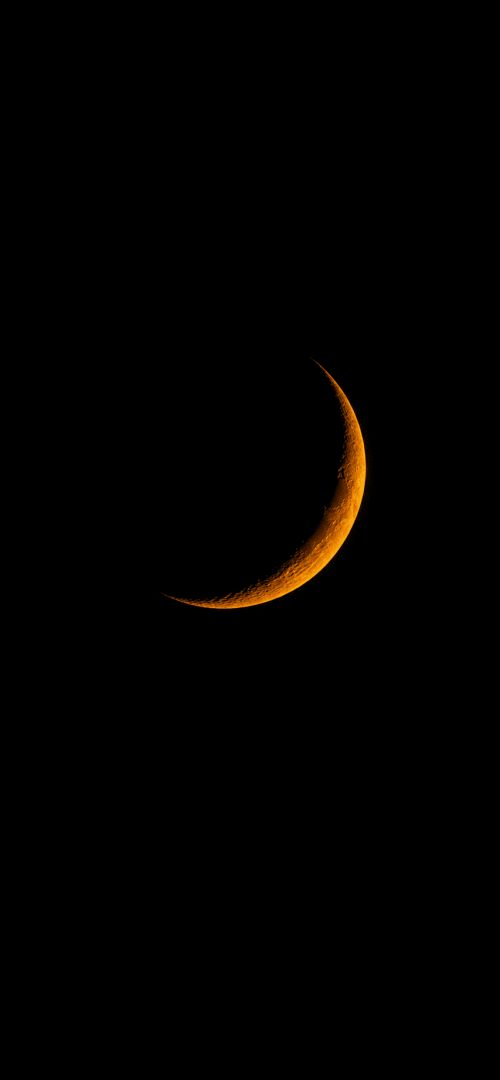 Golden crescent in dark skies wallpaper