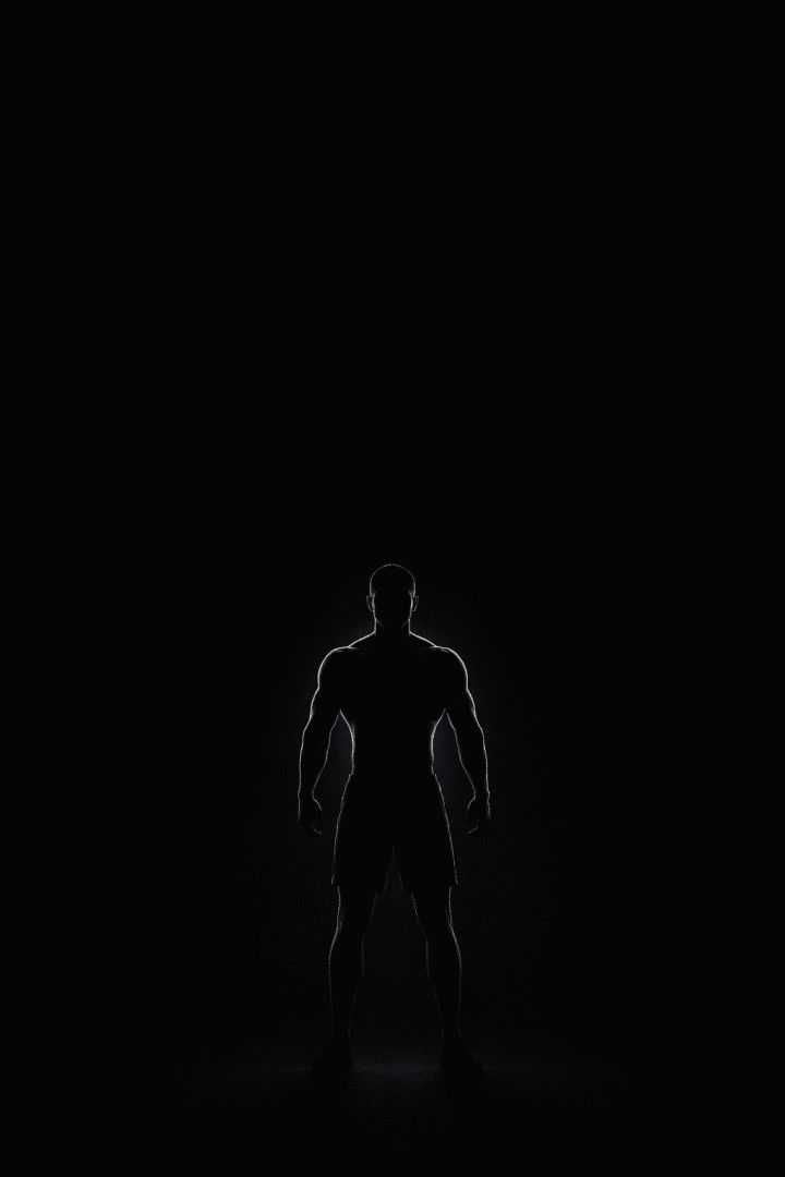 Powerful silhouette in dramatic light gym wallpaper