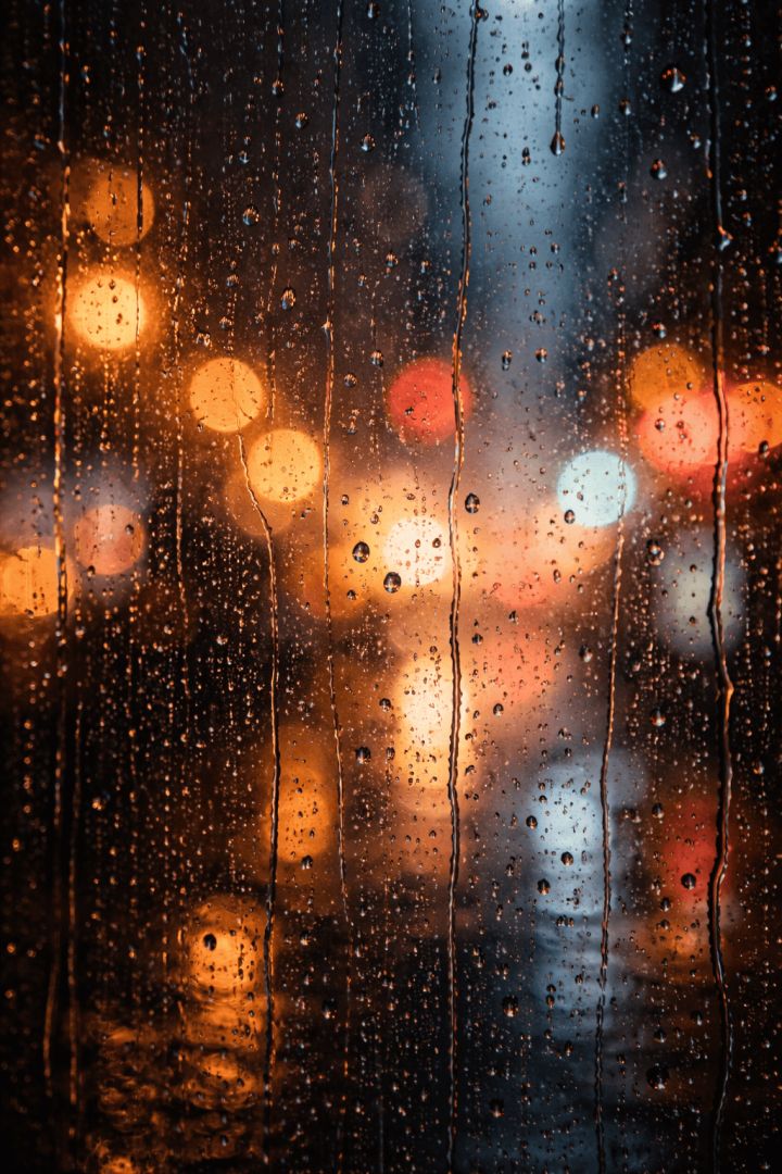 Rainy night through city window rain wallpaper